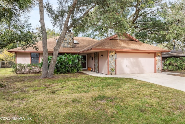 ranch-style home featuring a garage and a front yard