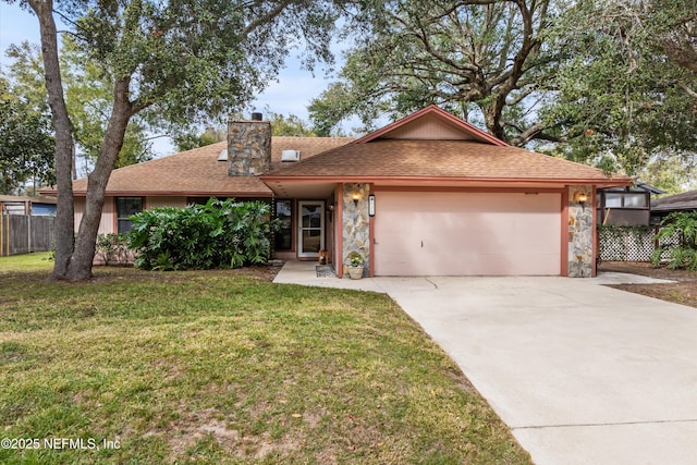 view of front facade with a garage and a front yard