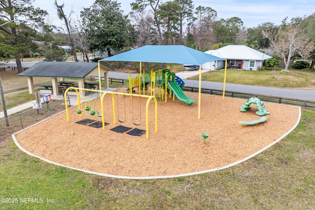 view of playground with a lawn