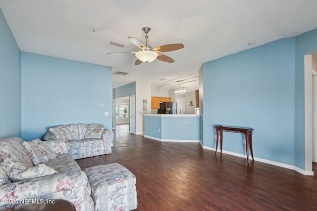 living room with vaulted ceiling, dark hardwood / wood-style floors, and ceiling fan