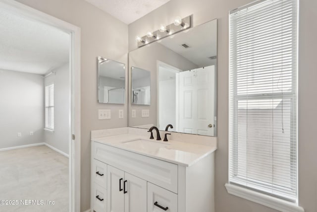 bathroom featuring vanity and a textured ceiling