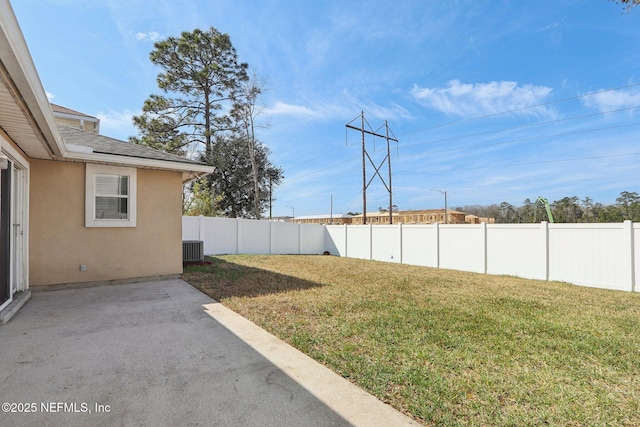 view of yard featuring central AC and a patio area