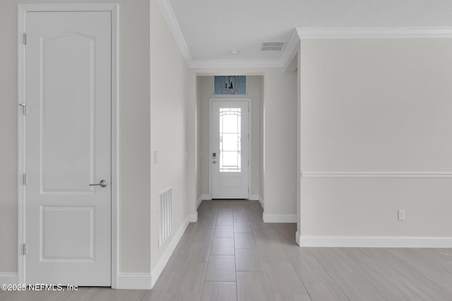 entrance foyer featuring ornamental molding