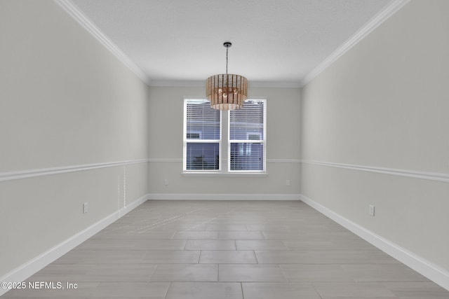 empty room featuring ornamental molding, a chandelier, and a textured ceiling