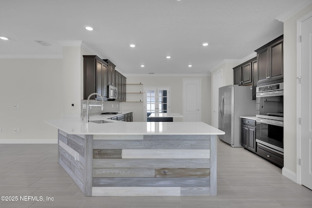 kitchen featuring ornamental molding, stainless steel appliances, kitchen peninsula, and decorative backsplash