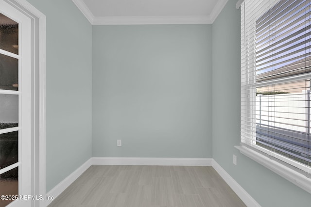 unfurnished room featuring crown molding