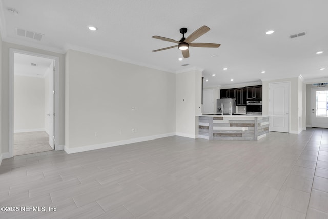 unfurnished living room featuring ceiling fan and ornamental molding