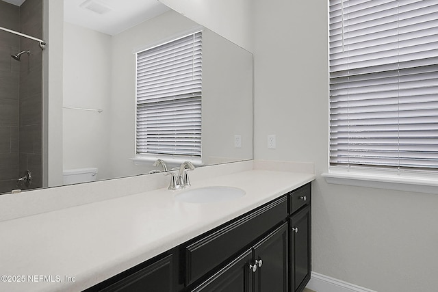 bathroom featuring vanity and a tile shower