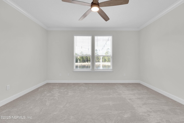 carpeted empty room with ornamental molding and ceiling fan