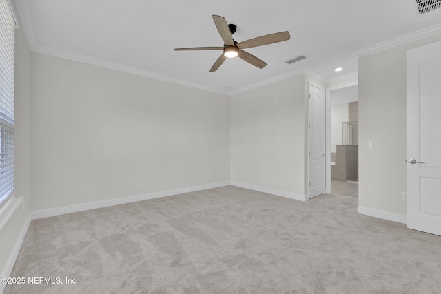 carpeted spare room featuring ornamental molding and ceiling fan