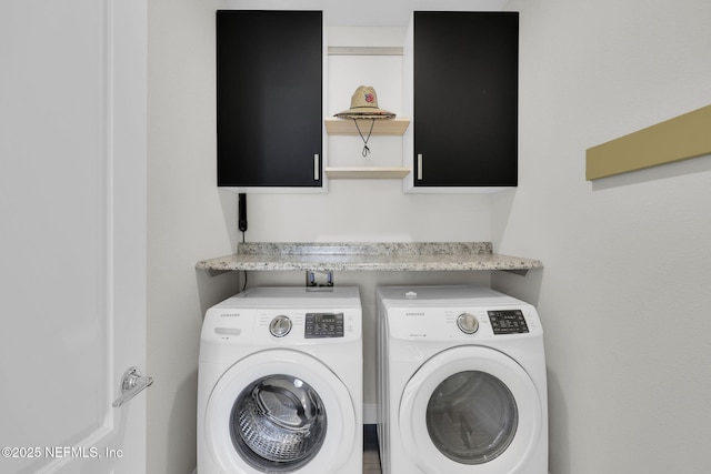 clothes washing area featuring washing machine and dryer