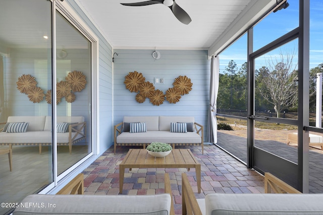 sunroom / solarium with ceiling fan