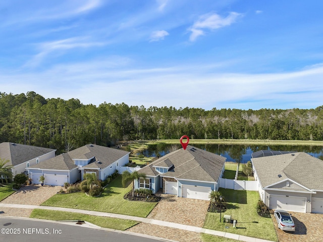 birds eye view of property with a water view