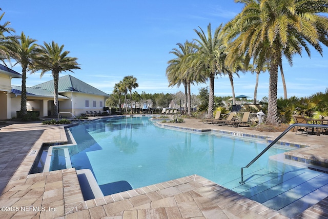 view of swimming pool with a patio