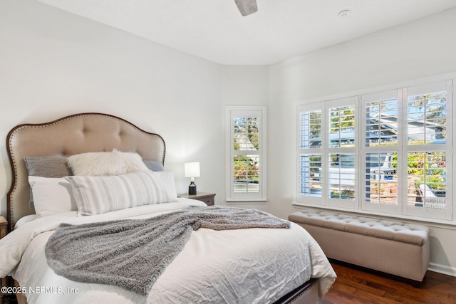 bedroom with dark wood-type flooring