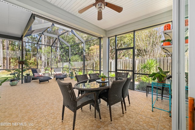 sunroom featuring a wealth of natural light and ceiling fan