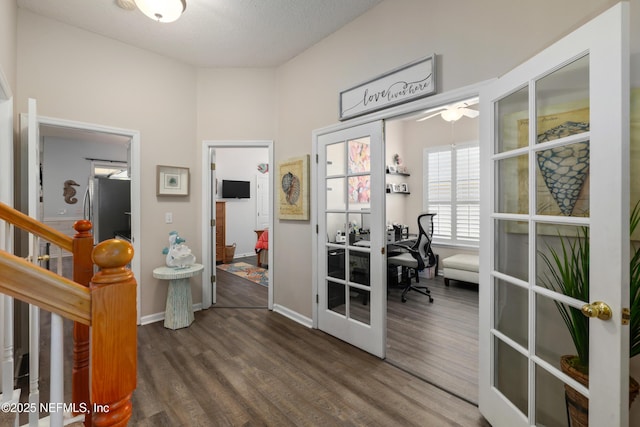 hall featuring french doors and dark hardwood / wood-style flooring