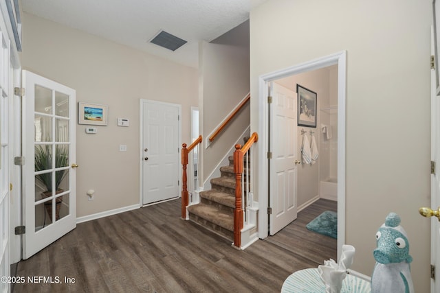 entrance foyer featuring dark hardwood / wood-style floors