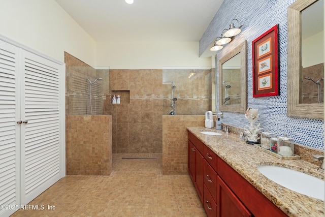 bathroom featuring vanity and a tile shower