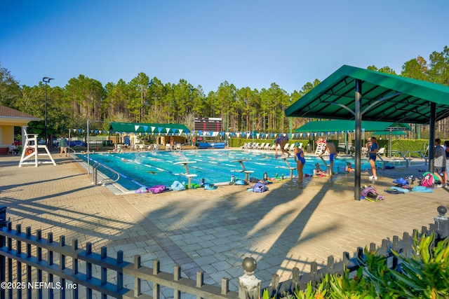 view of swimming pool with a patio