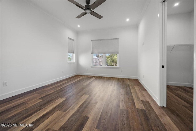 unfurnished room with crown molding, ceiling fan, and dark hardwood / wood-style flooring