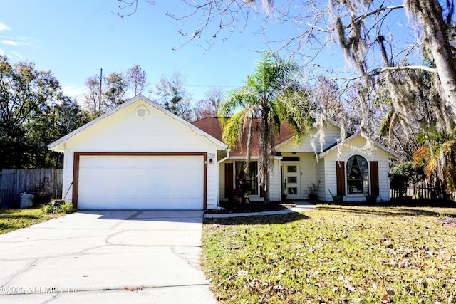 ranch-style house featuring a garage and a front yard