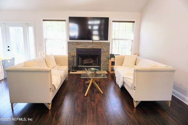 living room with lofted ceiling, a fireplace, and dark hardwood / wood-style flooring