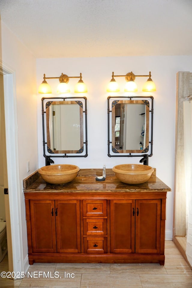 bathroom with vanity and toilet