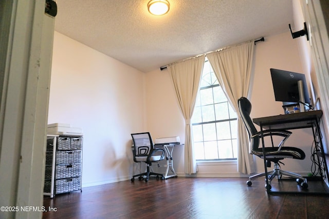 office with dark hardwood / wood-style floors and a textured ceiling