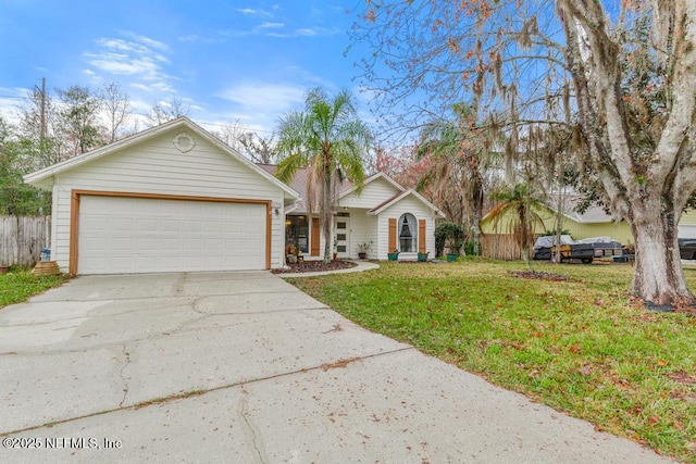 ranch-style house featuring a front lawn, concrete driveway, fence, and an attached garage