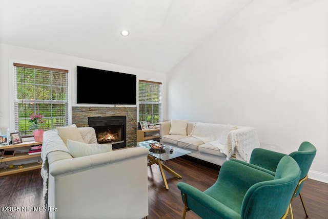 living area featuring lofted ceiling, recessed lighting, a fireplace, baseboards, and dark wood finished floors