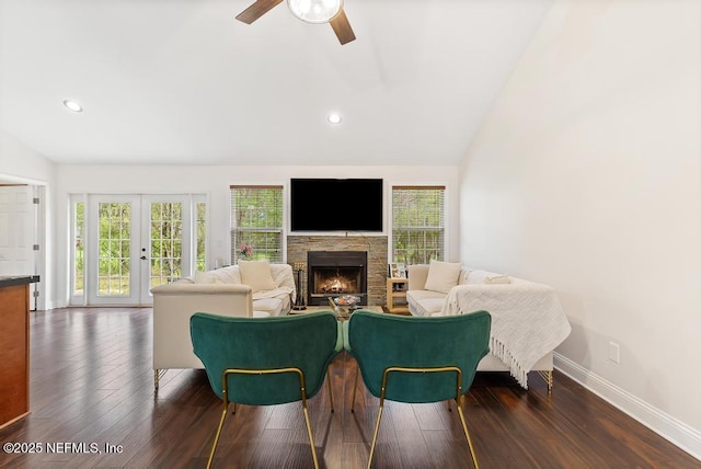 living room with lofted ceiling, dark wood-style flooring, and french doors