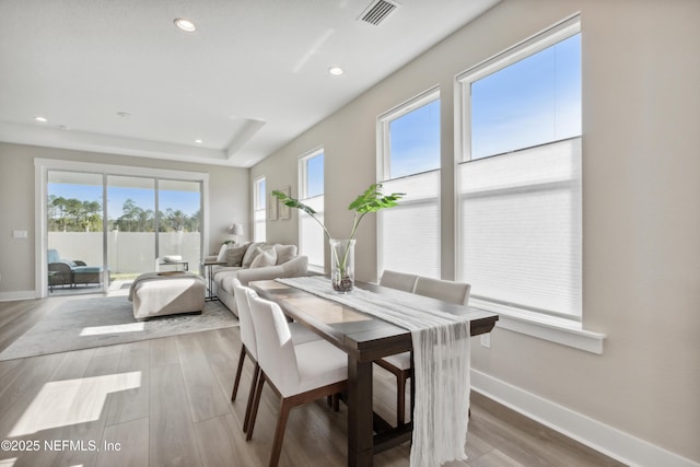 dining area with hardwood / wood-style flooring