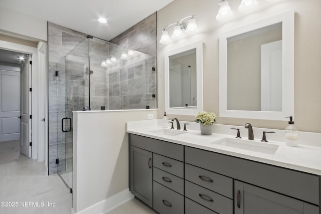 bathroom with vanity and a shower with door