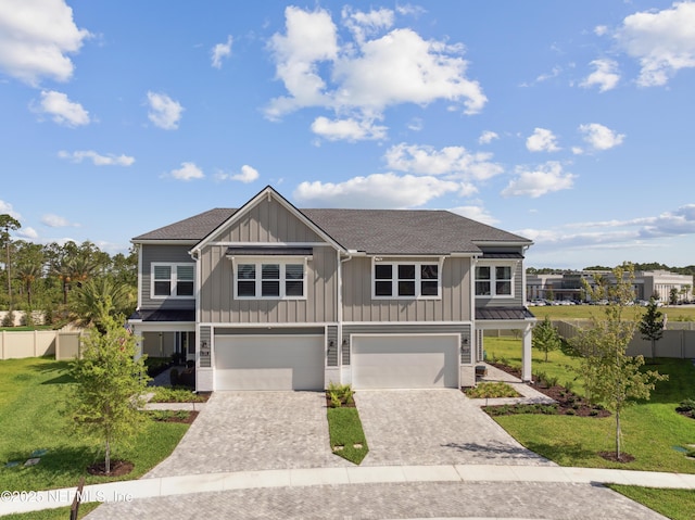 view of front facade with a garage and a front lawn