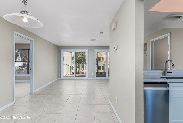 interior space with sink and a textured ceiling