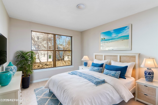 bedroom featuring light tile patterned flooring