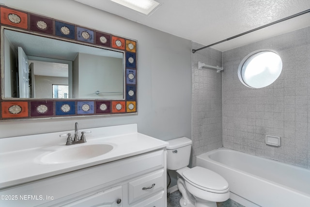 full bathroom with vanity, toilet, and tiled shower / bath