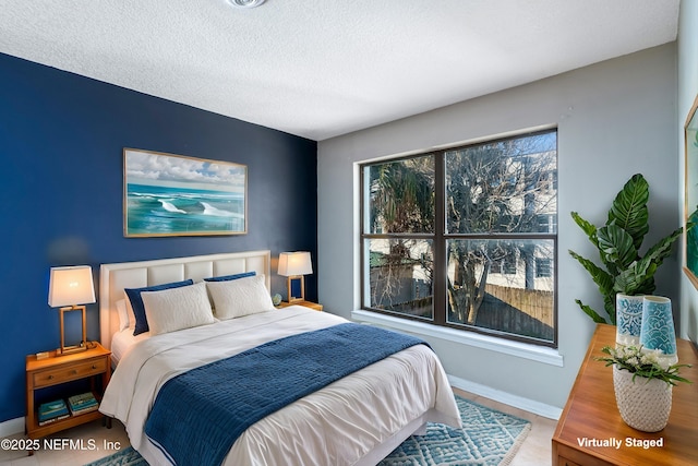 bedroom featuring a textured ceiling