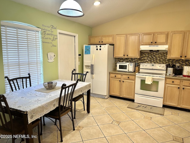 kitchen with lofted ceiling, backsplash, white appliances, and light brown cabinetry