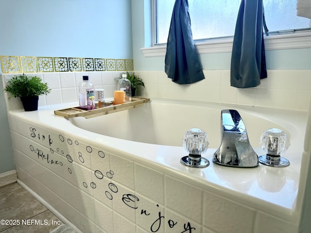 bathroom with tiled bath