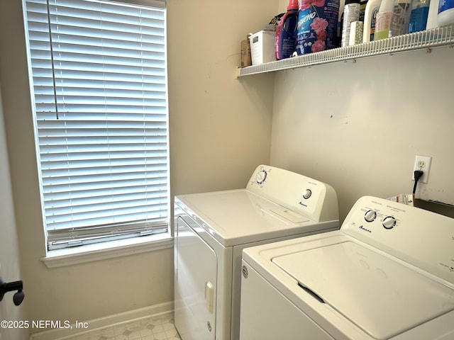 laundry room featuring washing machine and clothes dryer