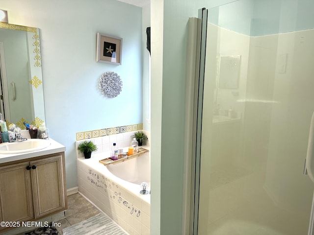 bathroom with independent shower and bath, vanity, and tile patterned flooring