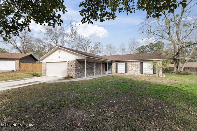 ranch-style house featuring a garage and a front yard