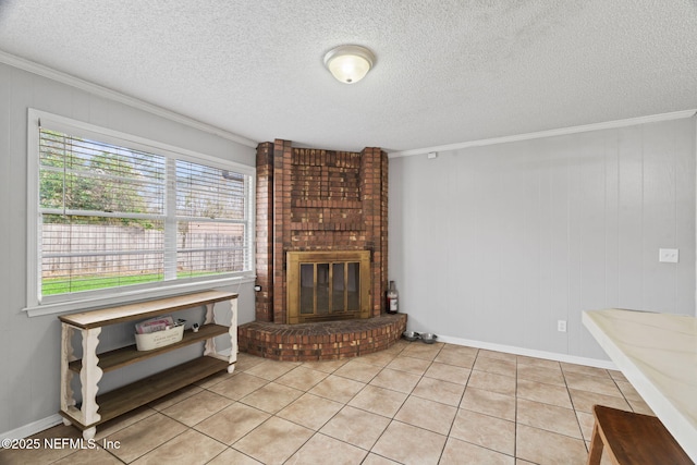 unfurnished living room with light tile patterned flooring, ornamental molding, a brick fireplace, and a textured ceiling