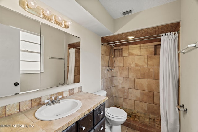 bathroom with vanity, toilet, and a shower with shower curtain