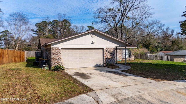 view of front of house with a garage and a front lawn