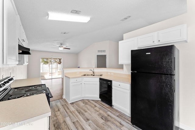 kitchen featuring sink, white cabinetry, light wood-type flooring, kitchen peninsula, and black appliances