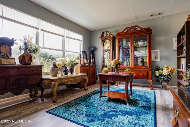 living area with hardwood / wood-style flooring