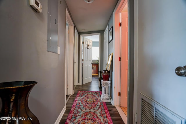 hall with dark wood-type flooring